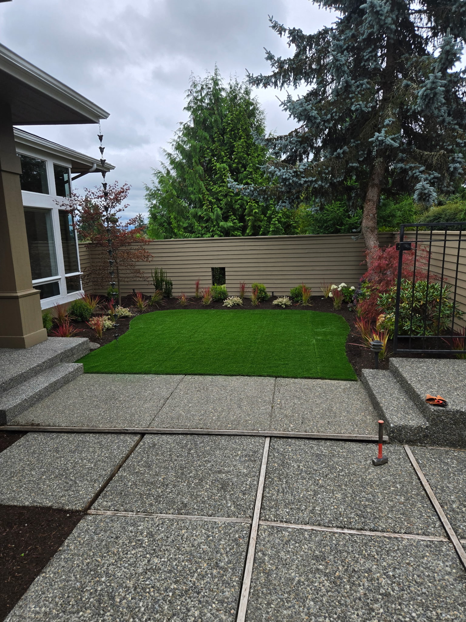 After: Lush artificial turf backyard